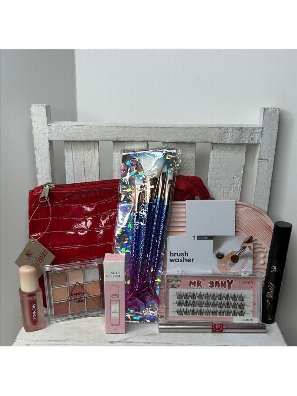 Red Makeup Bag with Assorted Beauty Products